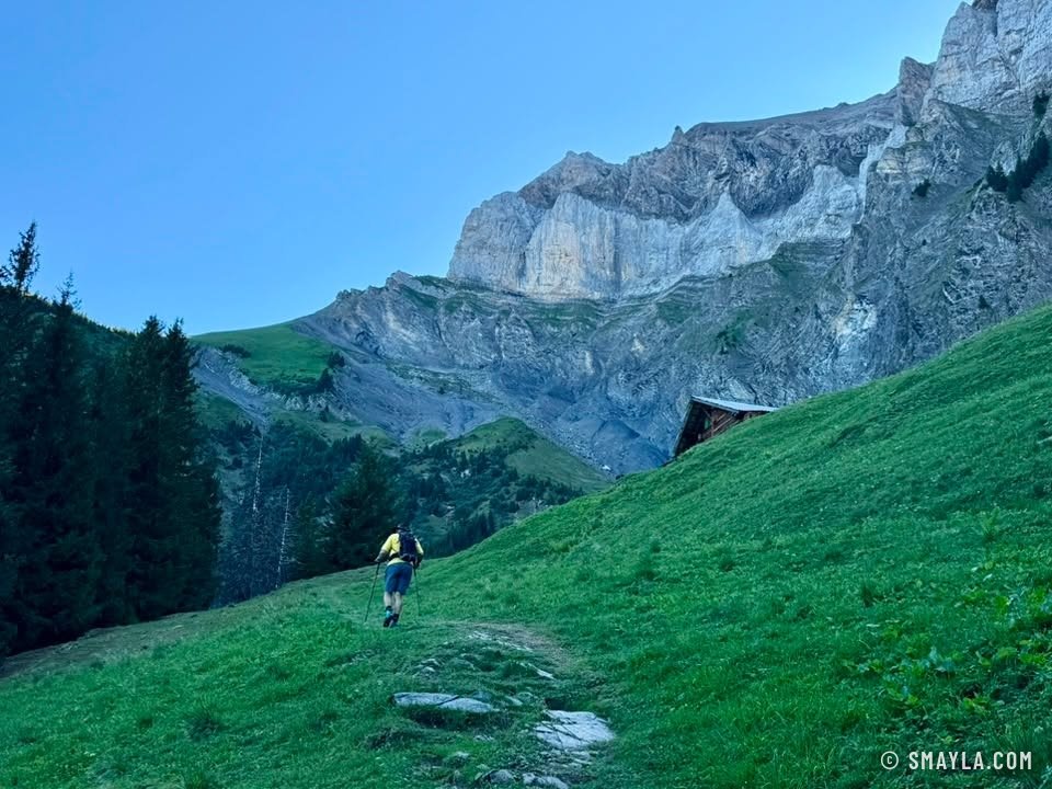 Climbing through grass below the walls