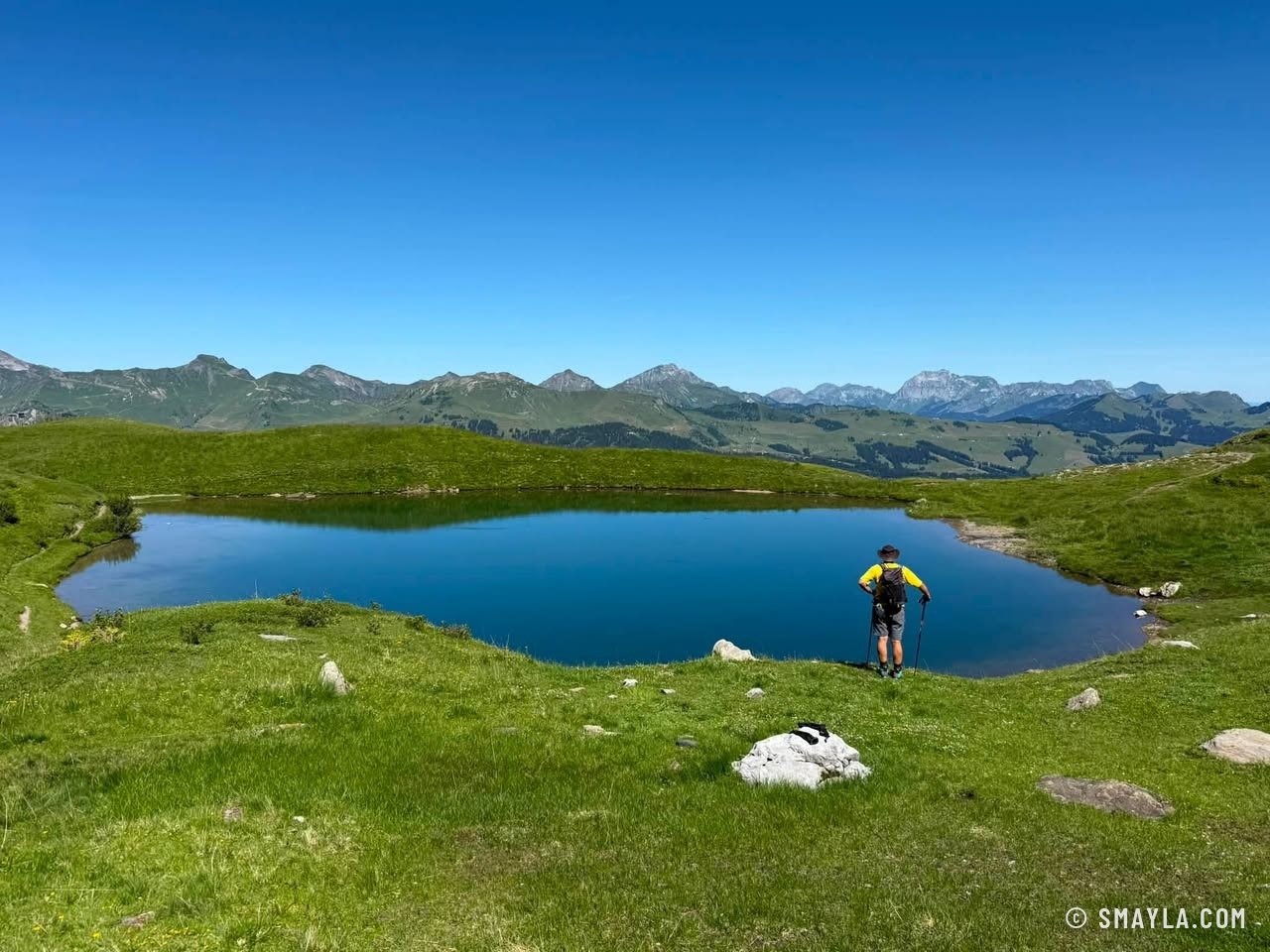 Christian by a blue lake