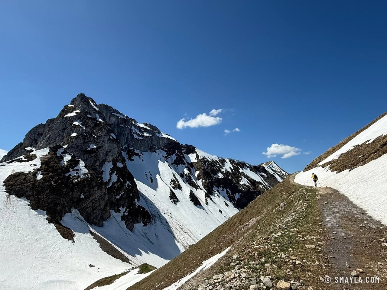 Snowy peak above the path