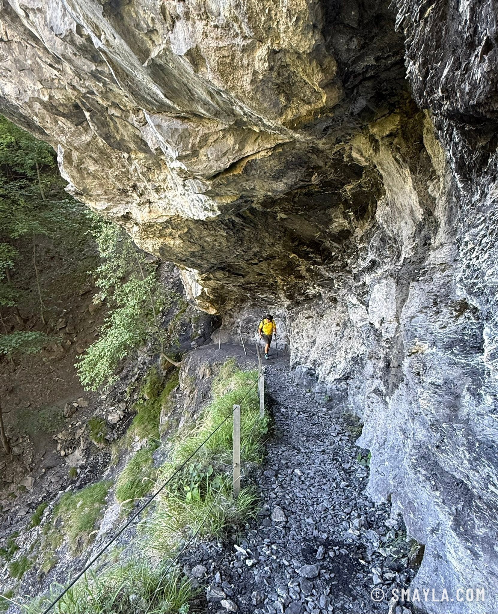 Path under the hollowed cliff