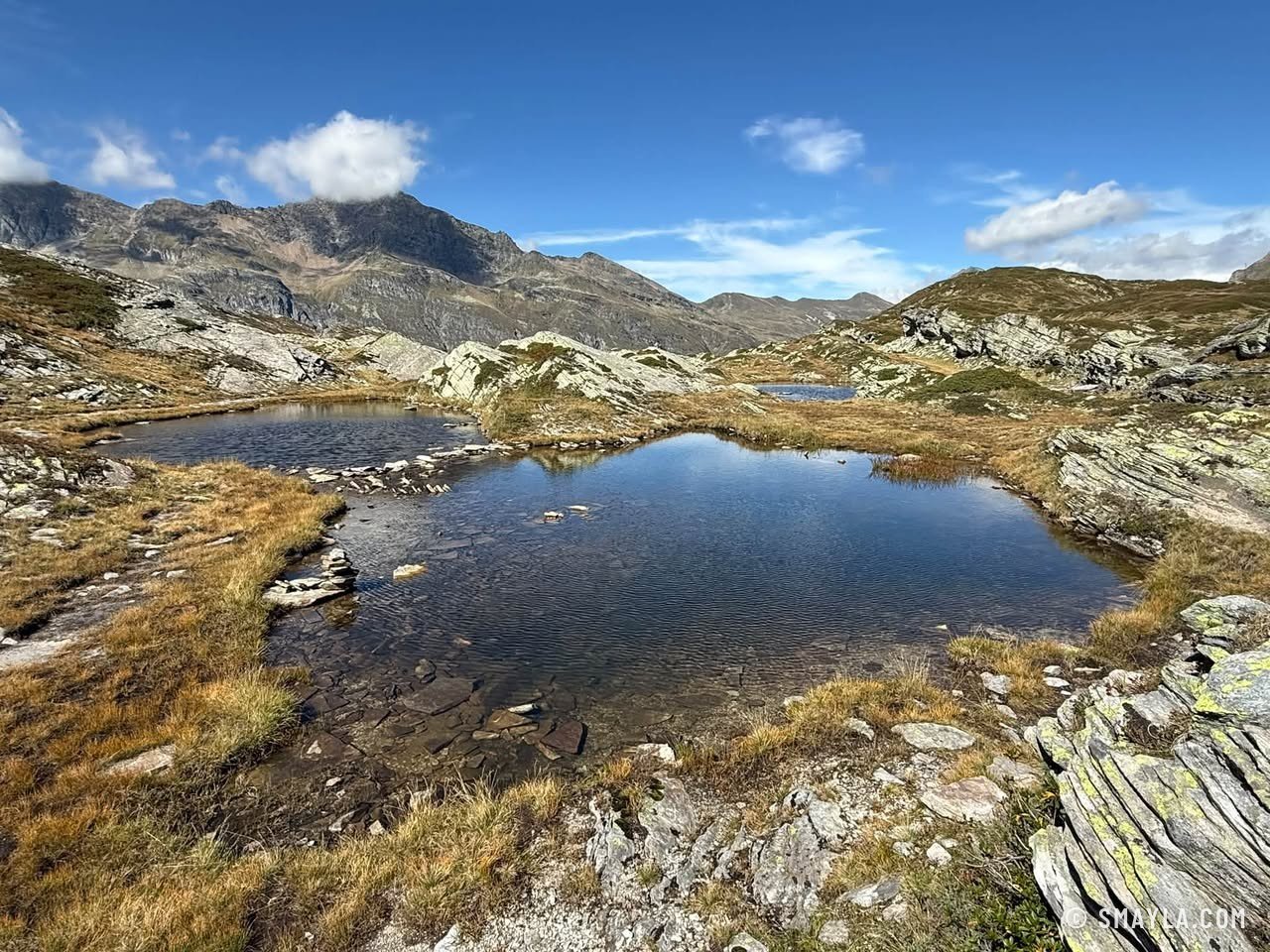 Small lake between gneiss slabs