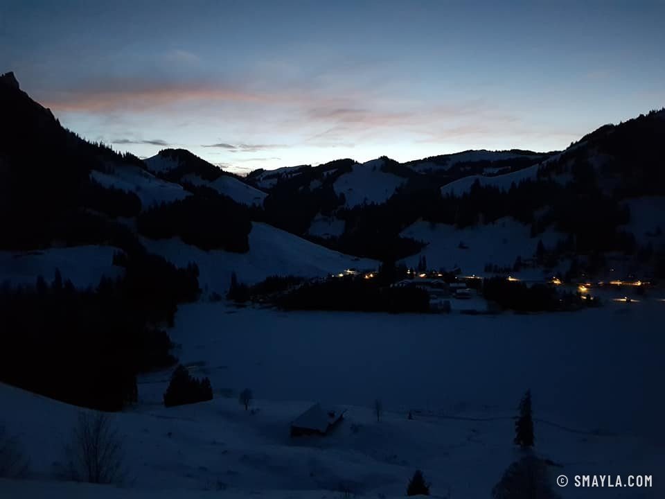 The village lights up by the lake